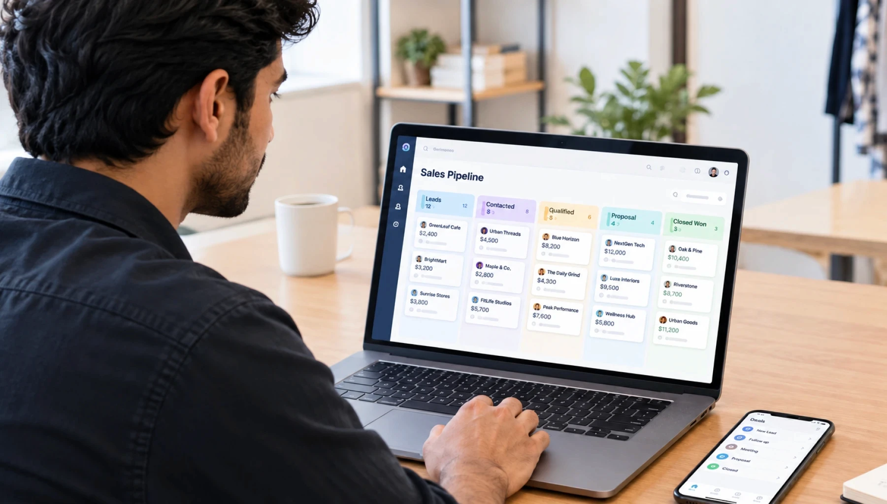 Small business owner comparing AI CRM tools and managing a sales pipeline in 2026