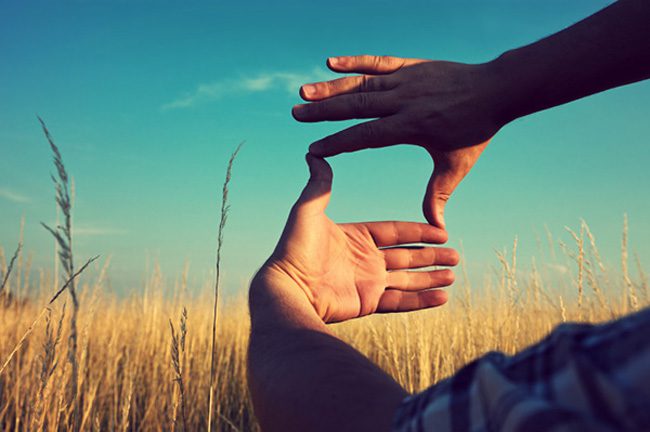 Two hands framing a view