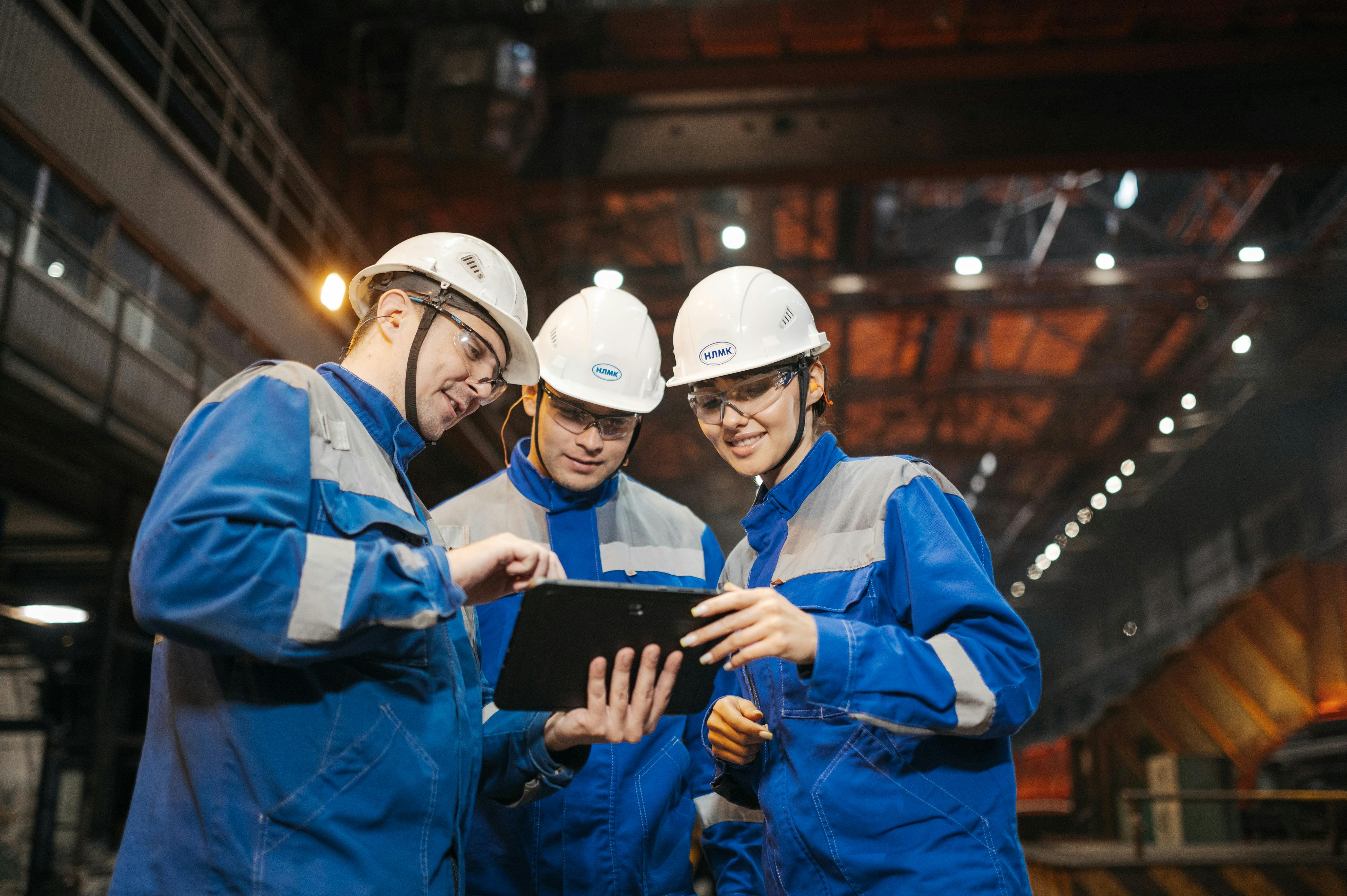 group-of-engineers-discussing-project-on-a-tablet-in-a-factory-setting. - sergey-sergeev (pexels)