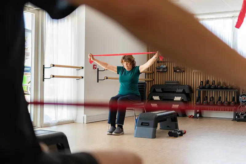 Clinician supervising a strength assessment