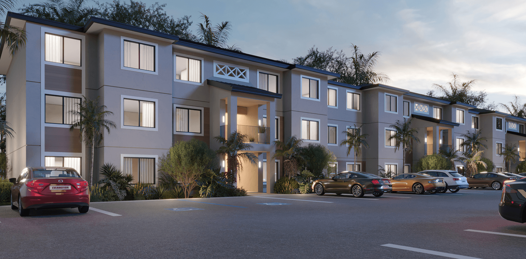 Exterior evening view of Residences at East End showing residential buildings with street level activity and lighting