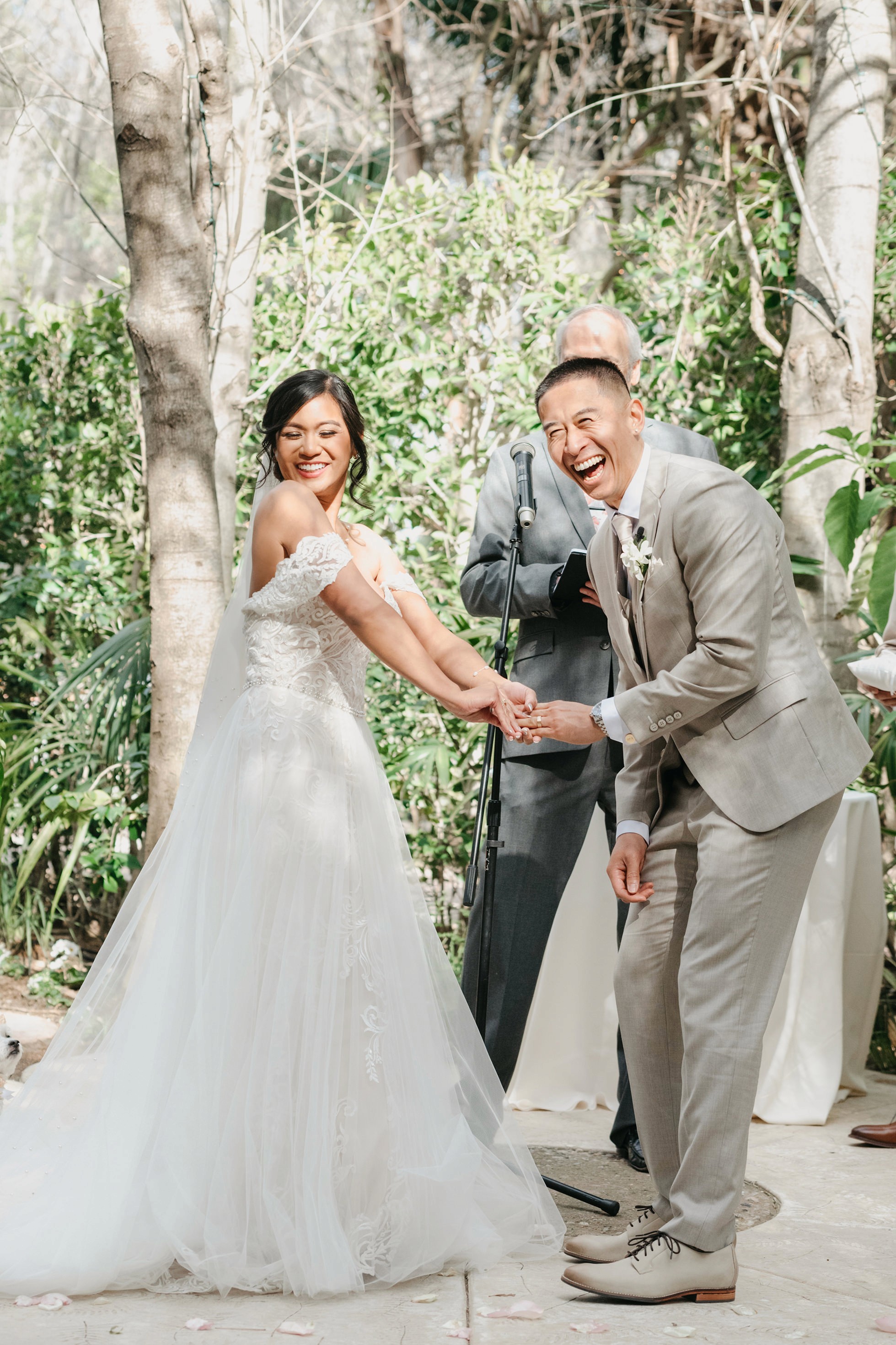 Flat lay wedding details with bouquet, rings, and sparkling bridal heels