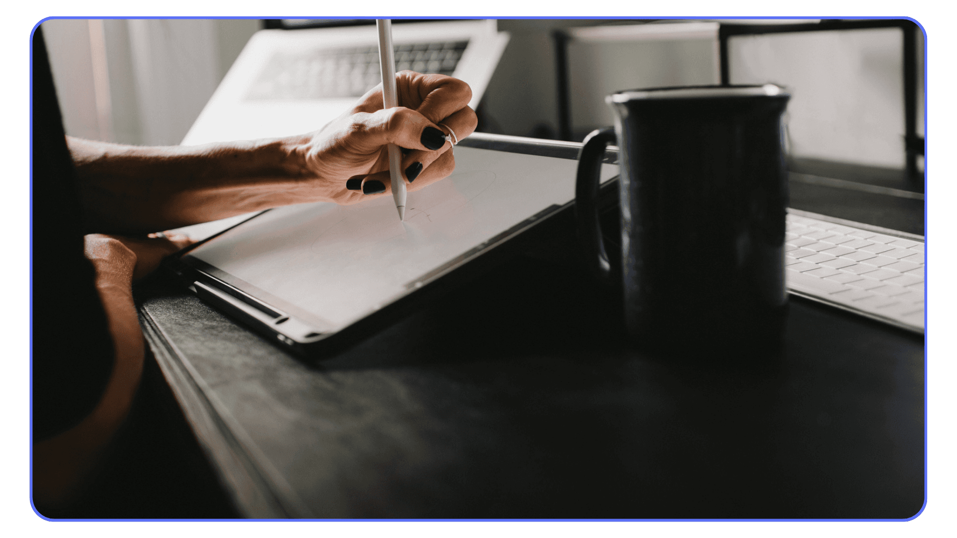 Artist sketching on an iPad with Apple Pencil at a workspace