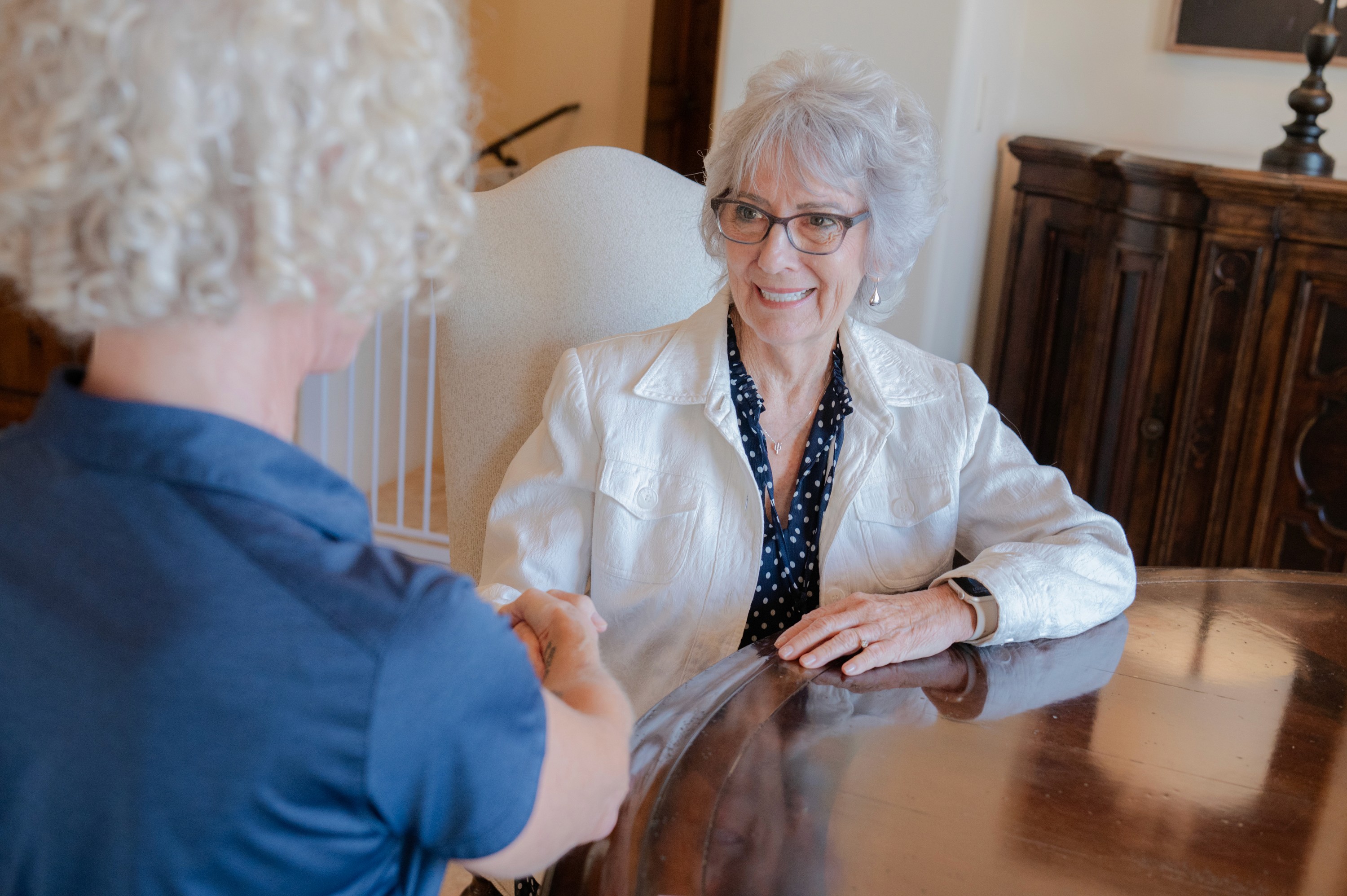 Total Care Connections caregiver greeting client.