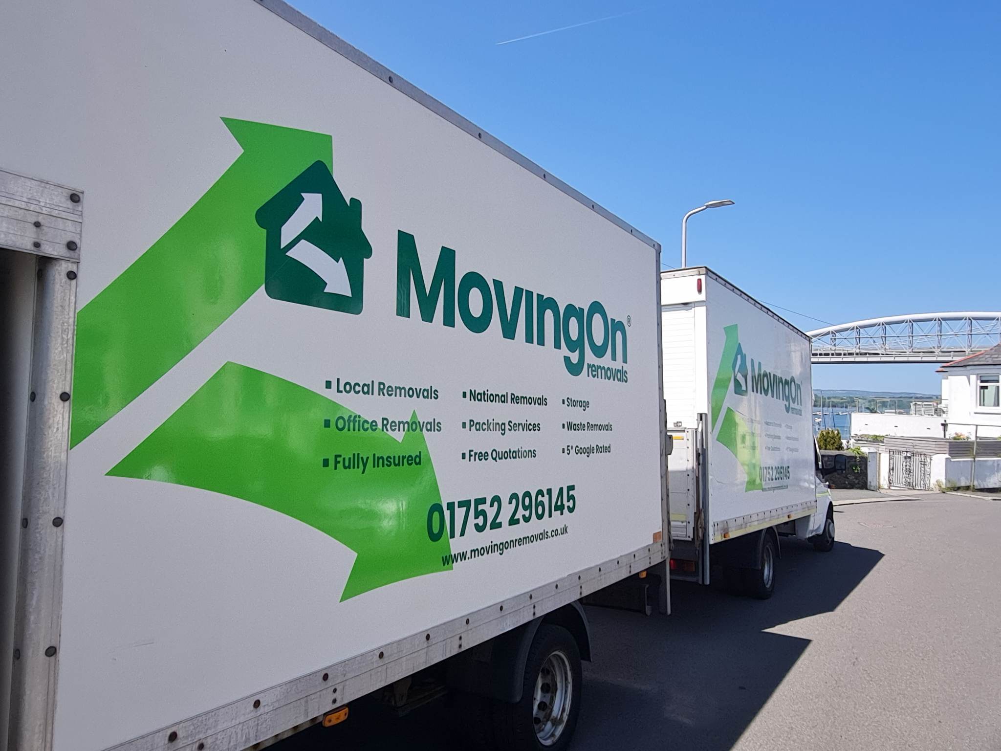 Two Moving On Removals vans parked and ready for a local Plymouth house move.