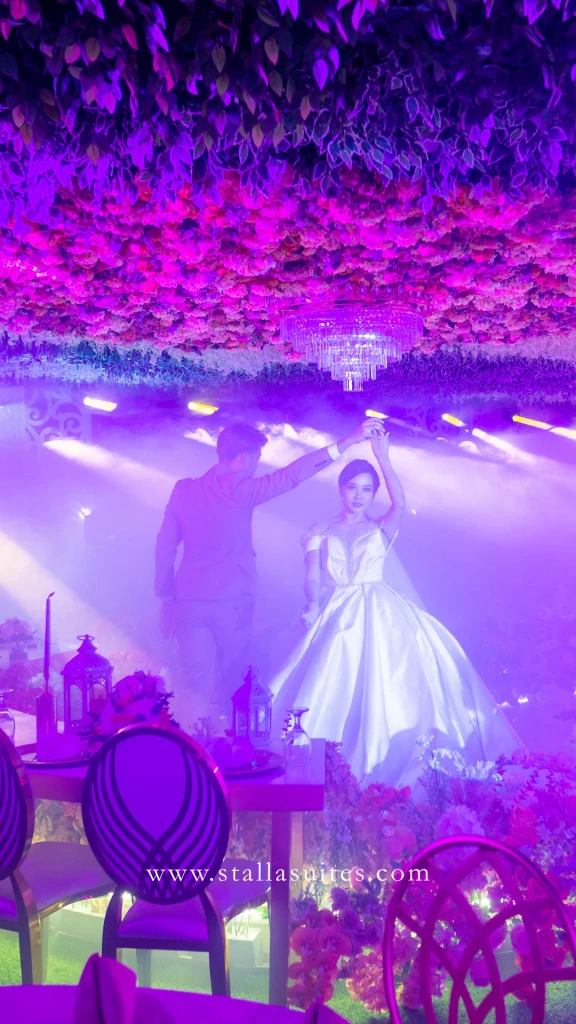 Couple's first dance in violet light at Stalla Suites Events Place QC