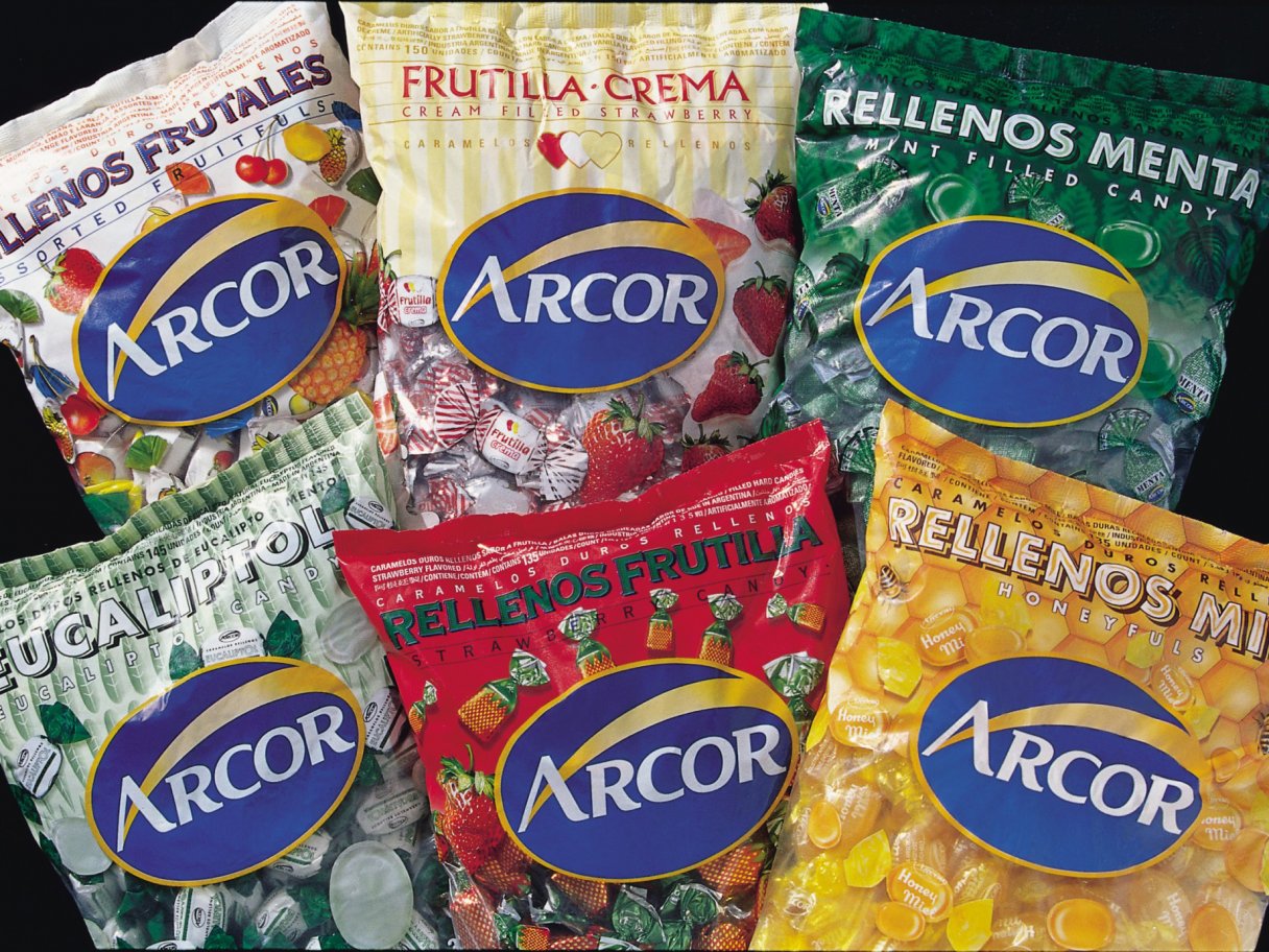 Rustic cabin in a golden field at sunset