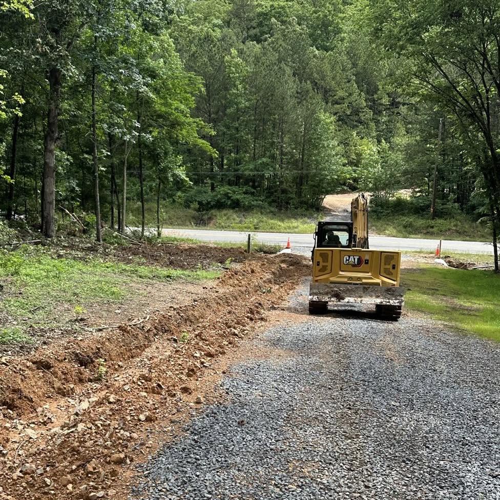 MSE grading an aggregate access road through a wooded site