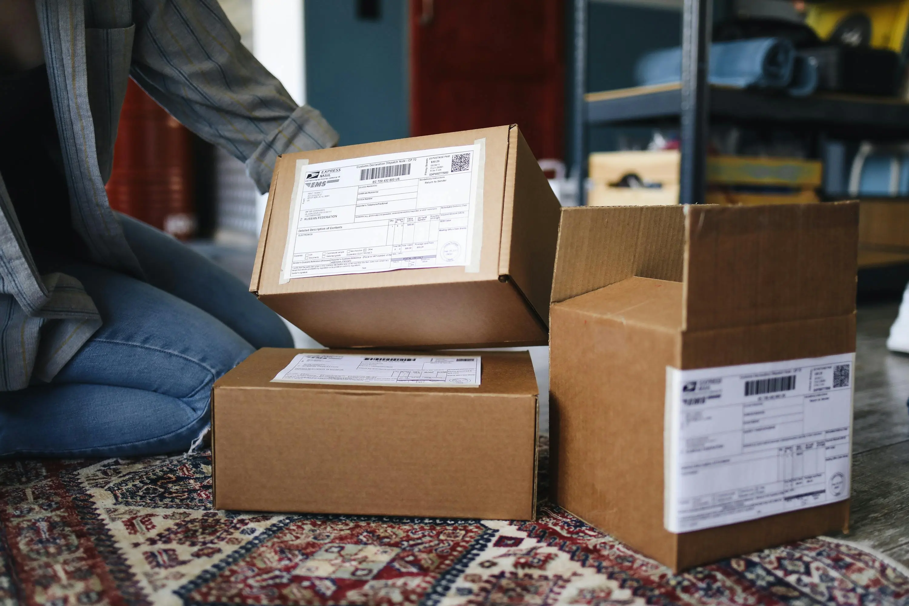 Person unpacking a delivered shipping box at home