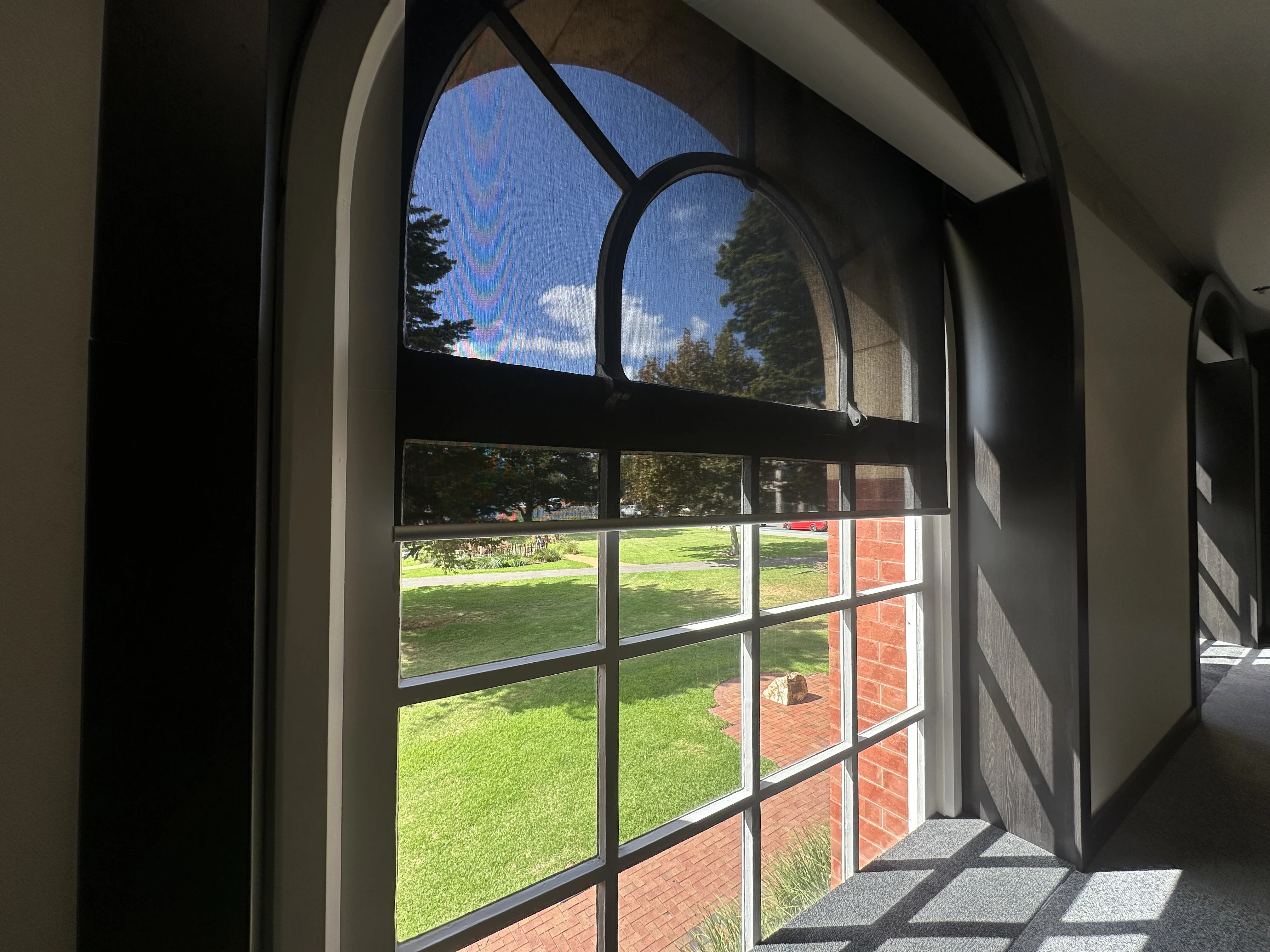 Motorised day-night roller blinds installed in CEO office with dual fabric system