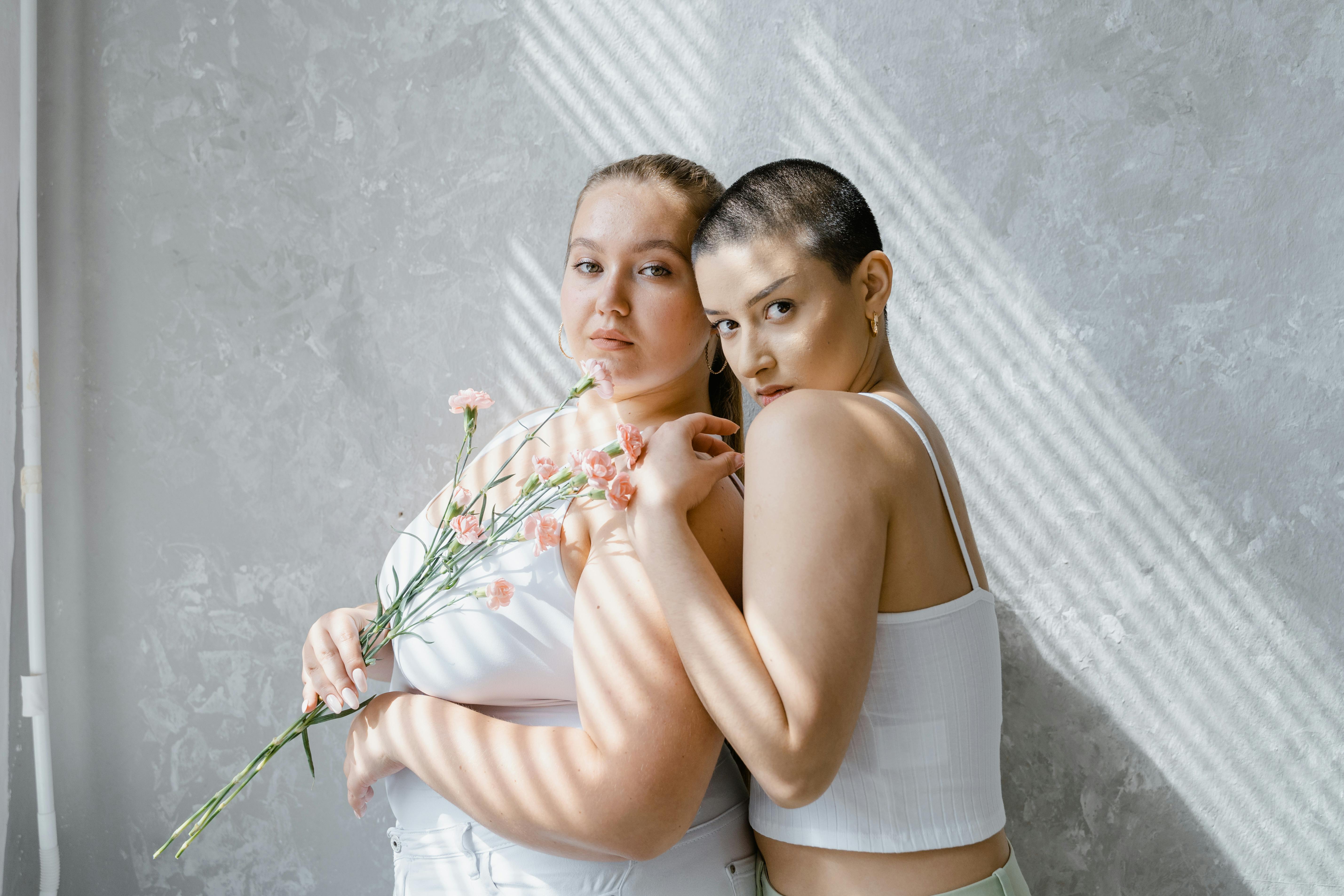 Two women embracing one another