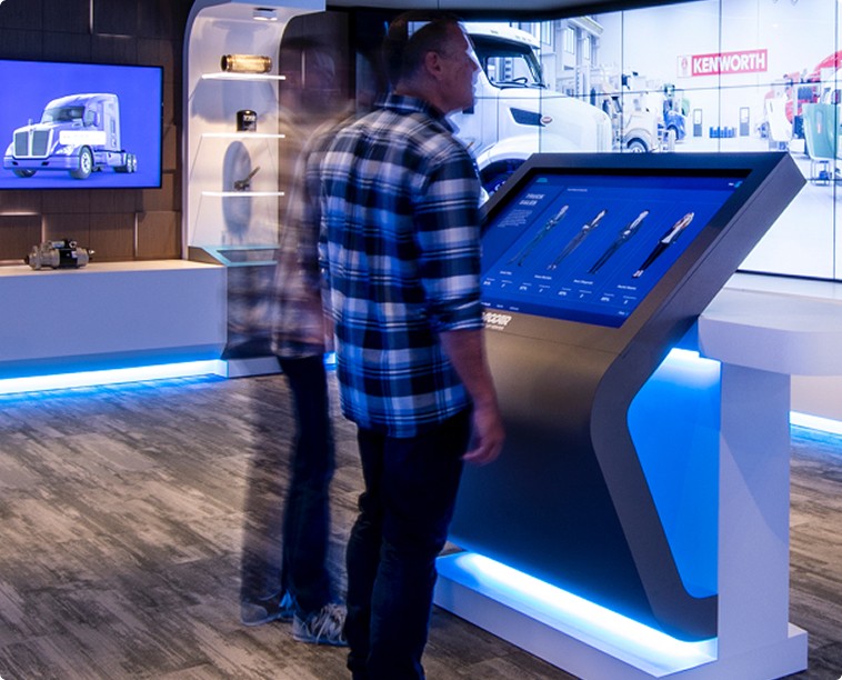 People standing in front of an interactive display