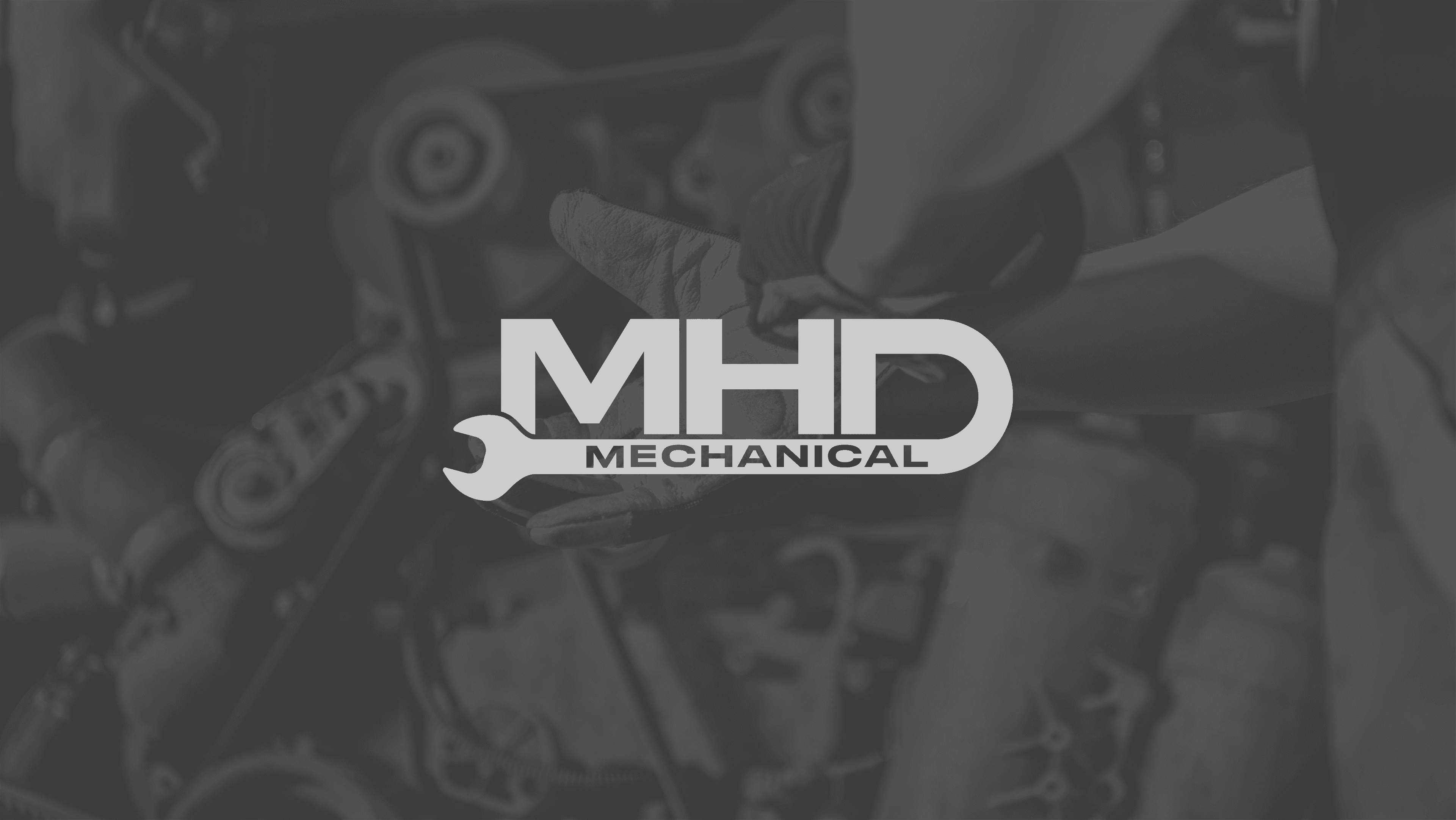 mhd logo overlayed on mechanical grey background