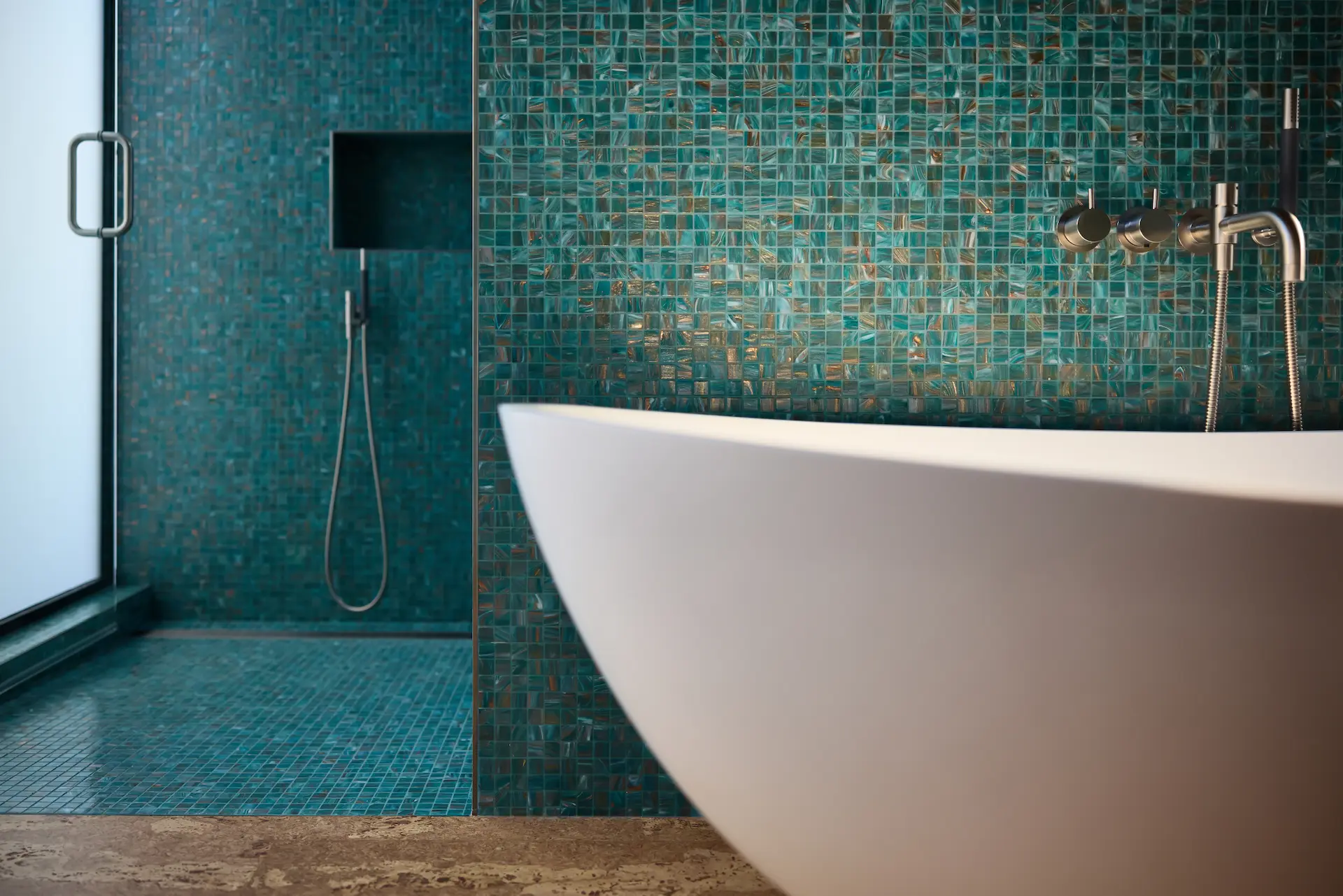 Wide view of the fully remodeled kitchen at an angle, showcasing modern appliances and quartz countertops in the Fairhills Eichler Tract home. Photo by Todd Huge.