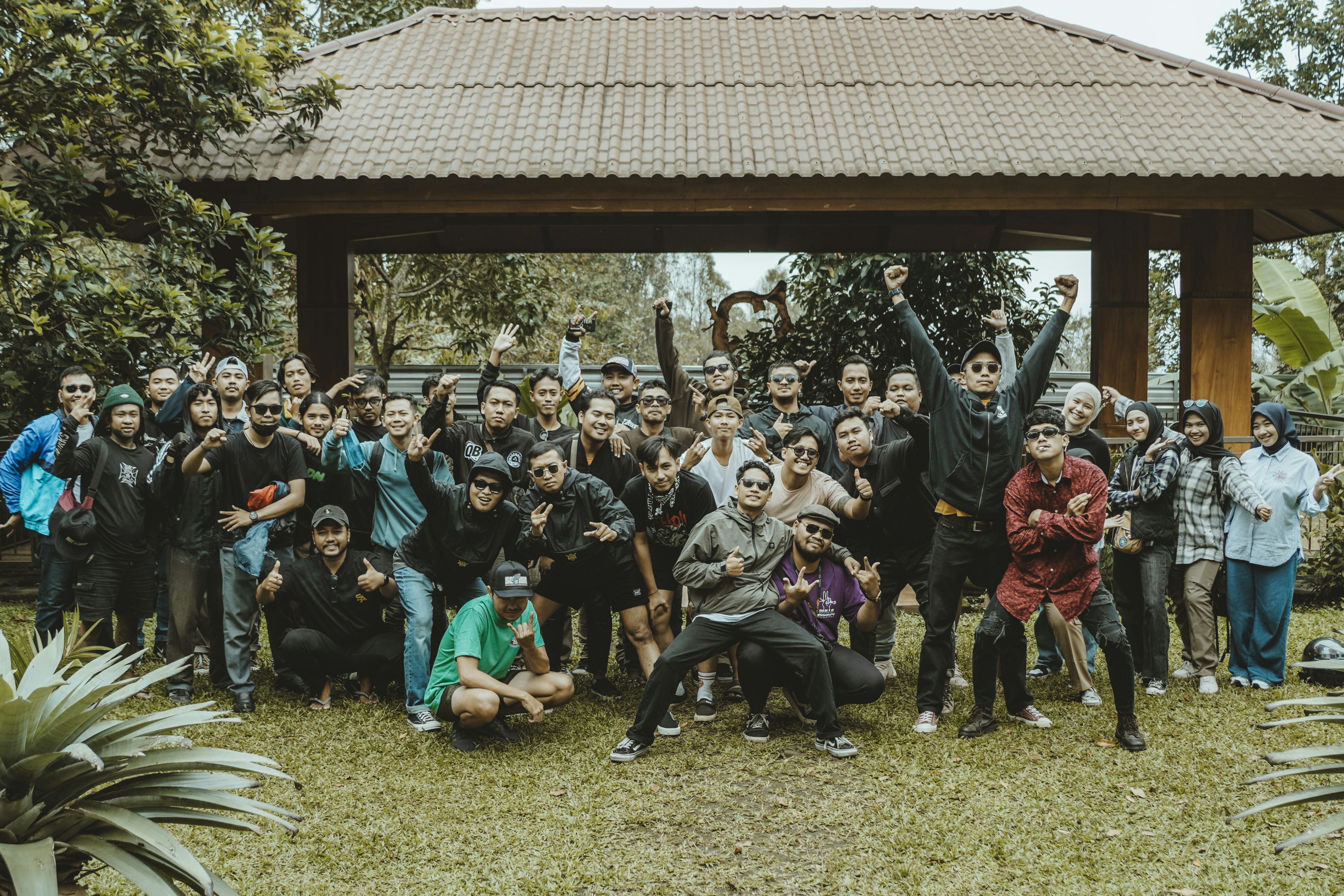 A large group of people smile for a photo.