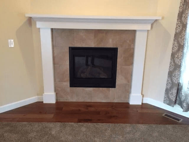 Flooring surrounding a fireplace installation by Shilling's Carpets & Floors