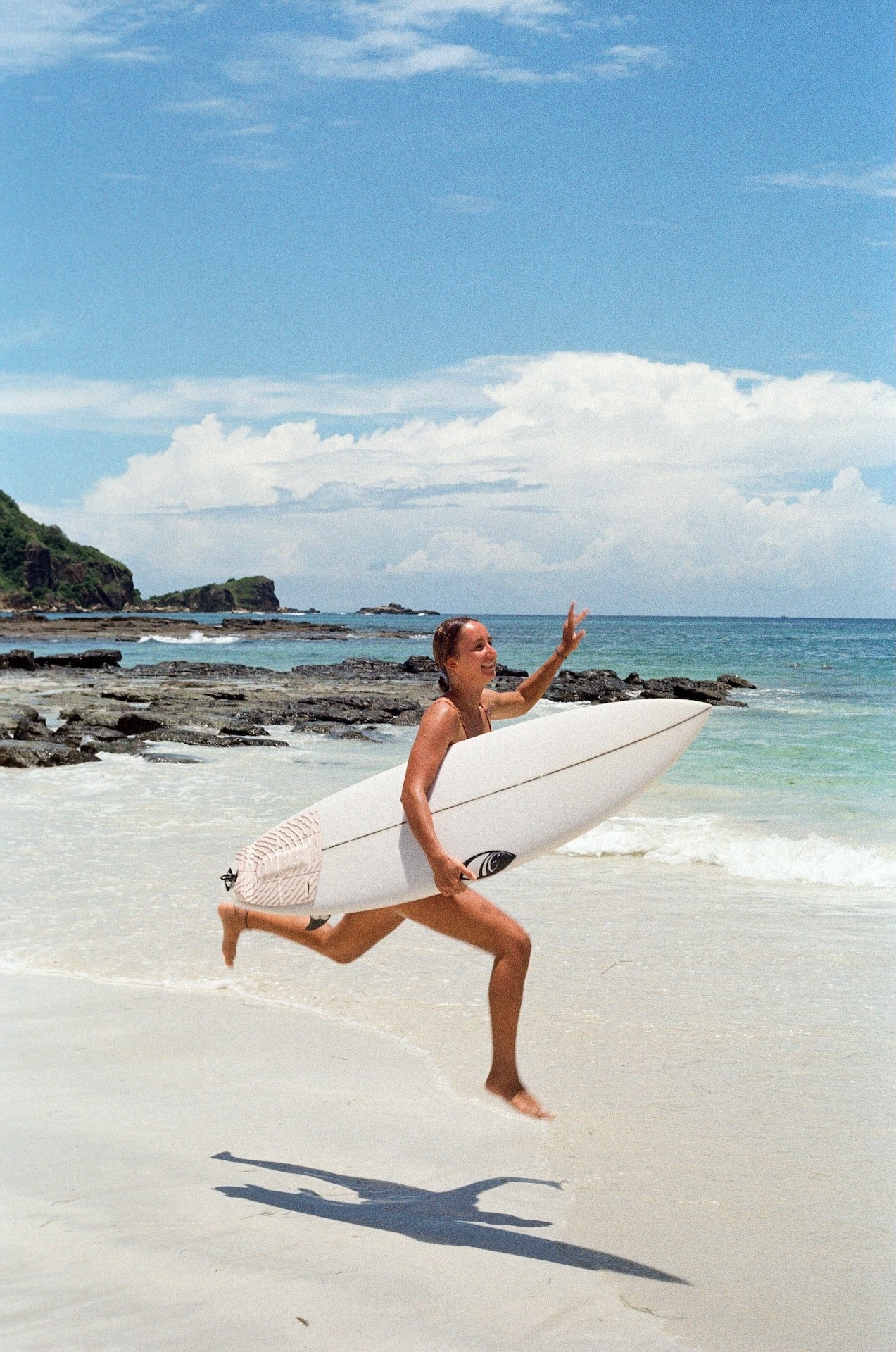 surfer girl with surfboard 