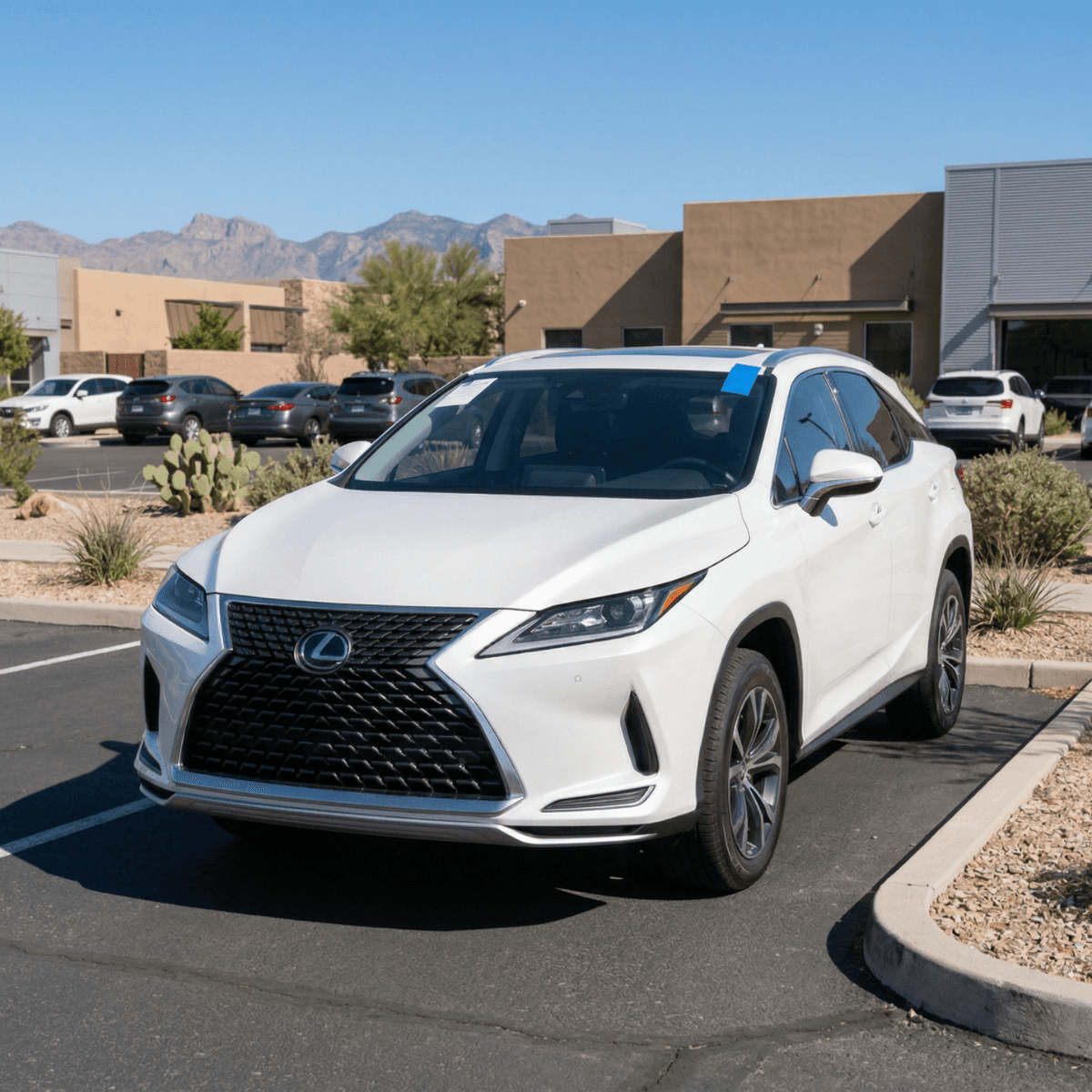 Mobile windshield repair on a white Lexus RX at a Tucson, AZ business park parking lot