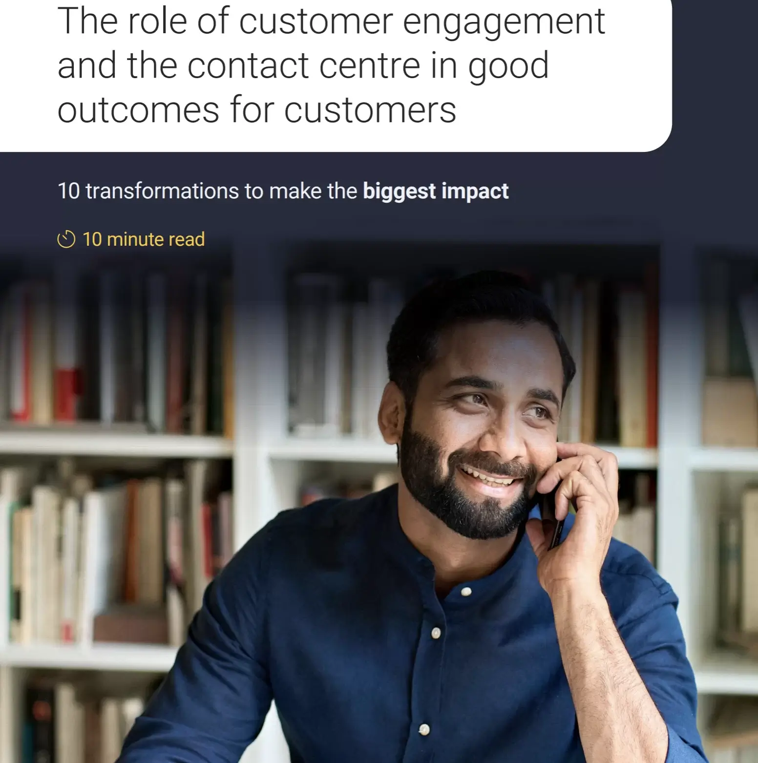 Image of a man on a mobile phone smiling.