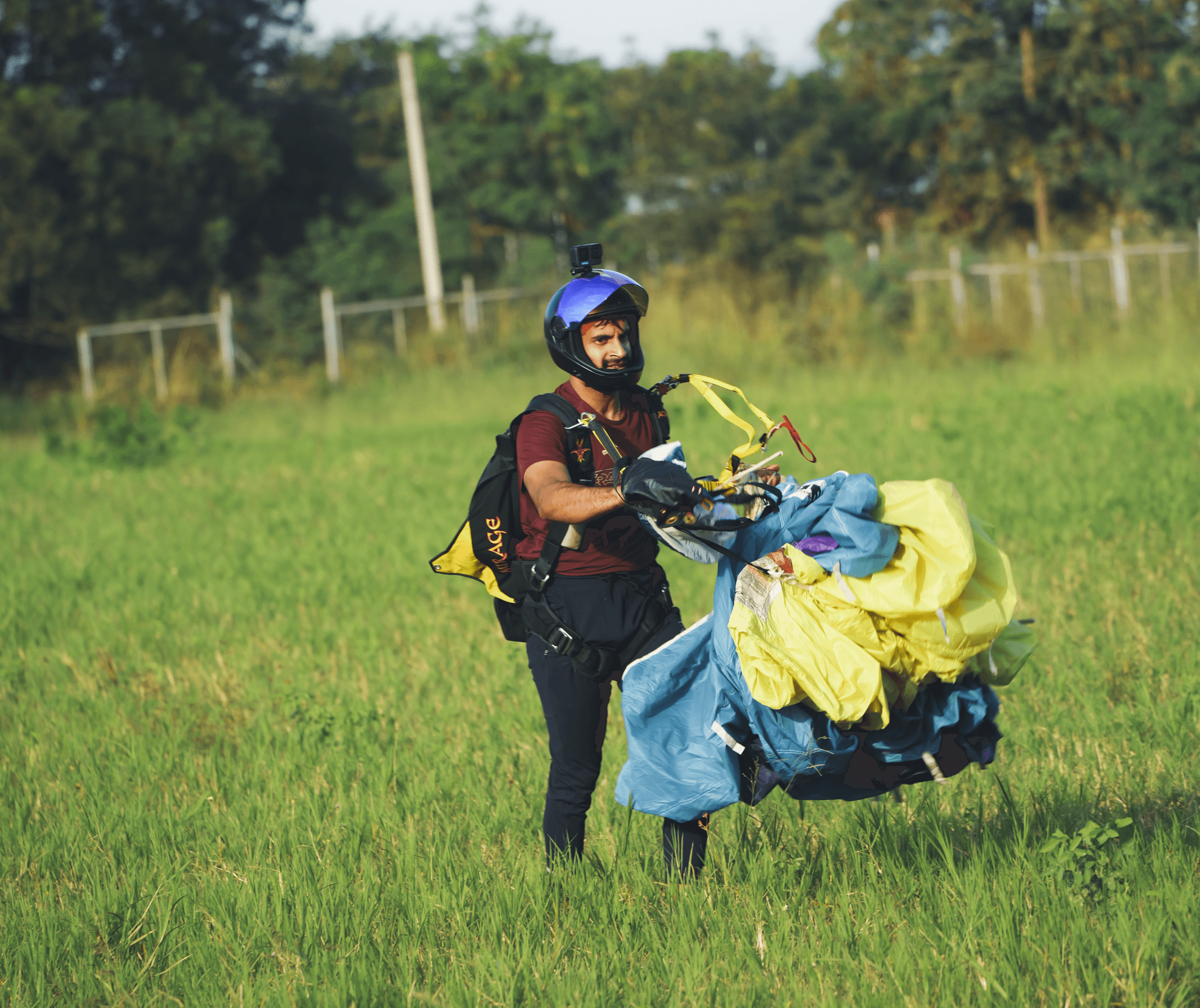 Student landing under parachute canopy