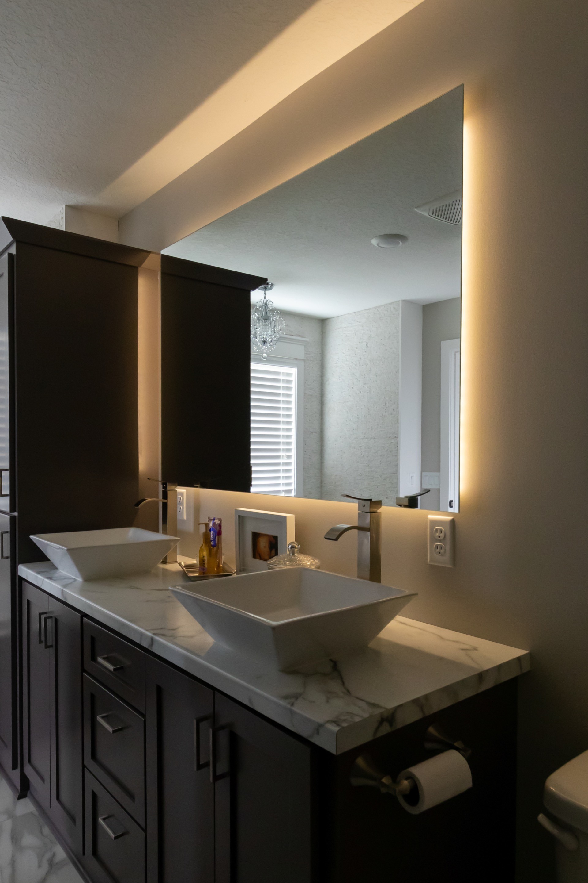 three men sitting on chair beside tables