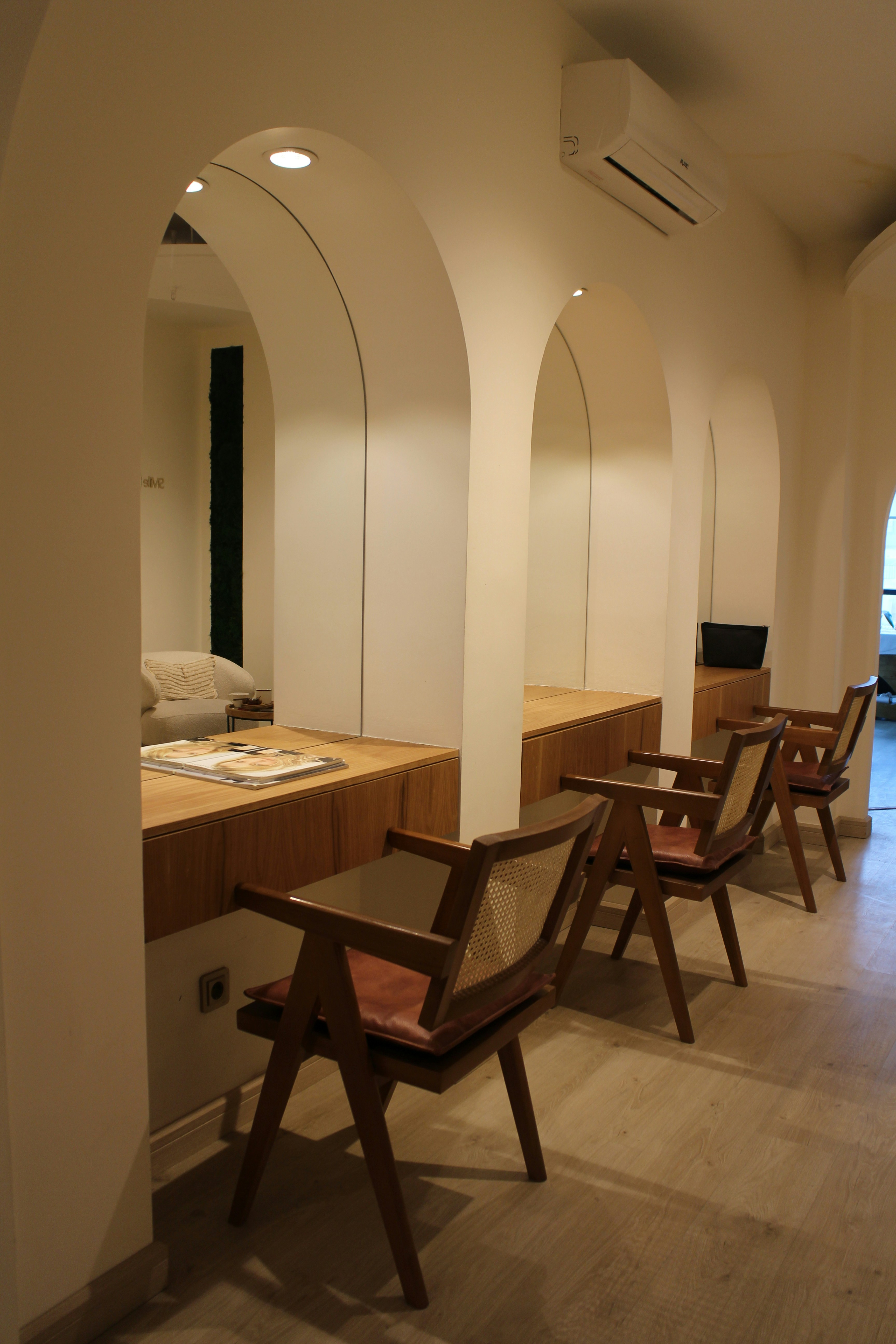 A row of wooden chairs sitting next to each other