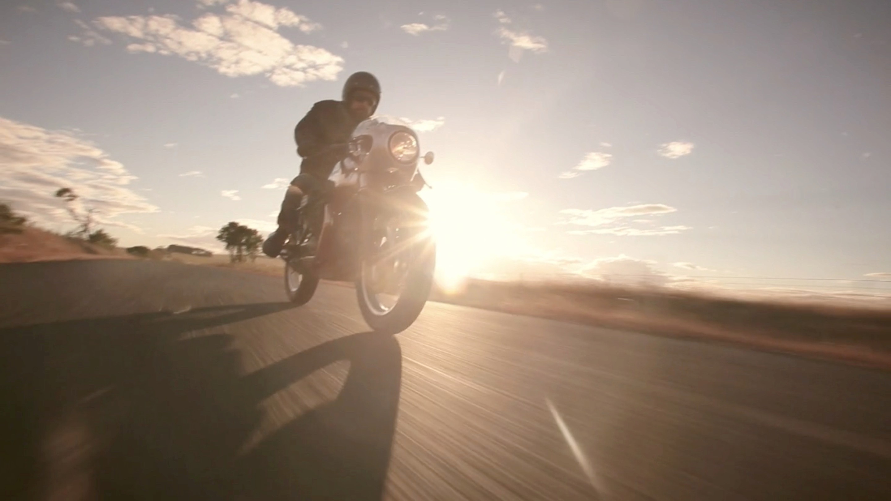 low angle man on nmotorcycle