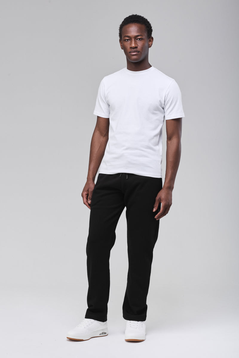 Sunday Superior Langley Sweatpants in clean black, male model front view