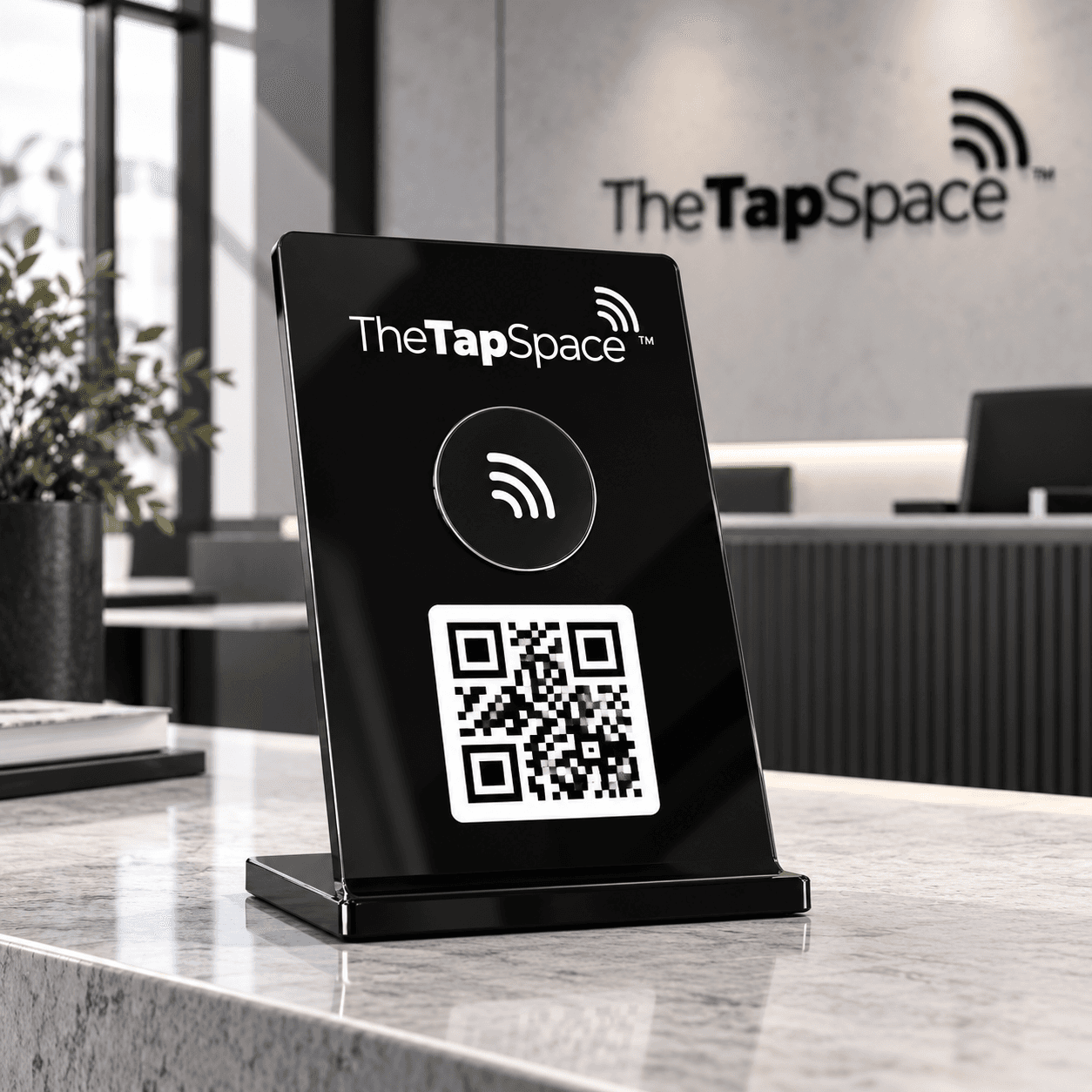 Black TapSpace NFC and QR countertop stand at a reception desk