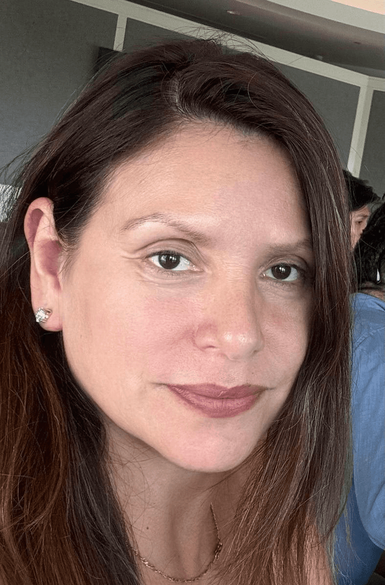 A 3D-rendered pink and white twisted knot sphere with smooth, glossy rope-like texture on a soft pastel background.