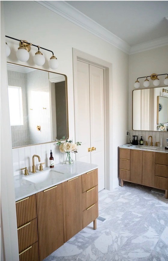 Modern living room with vertical garden, yellow sofas, and stylish coffee tables.