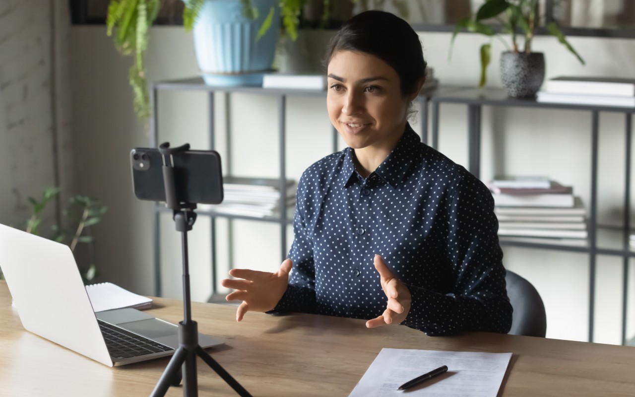 A student recording herself for a video project.