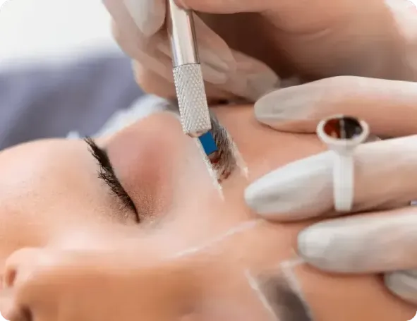 Close-up of microblading procedure, highlighting precise eyebrow strokes for natural-looking results.