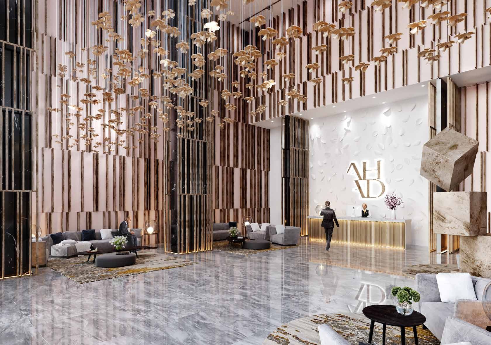 Grand entrance lobby at Ahad Residences with designer lighting and sophisticated architectural features.