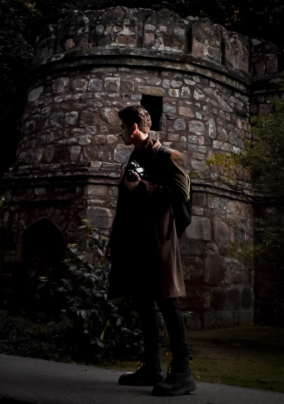 boy in black long sleeve shirt sitting on chair in front of black flat screen tv