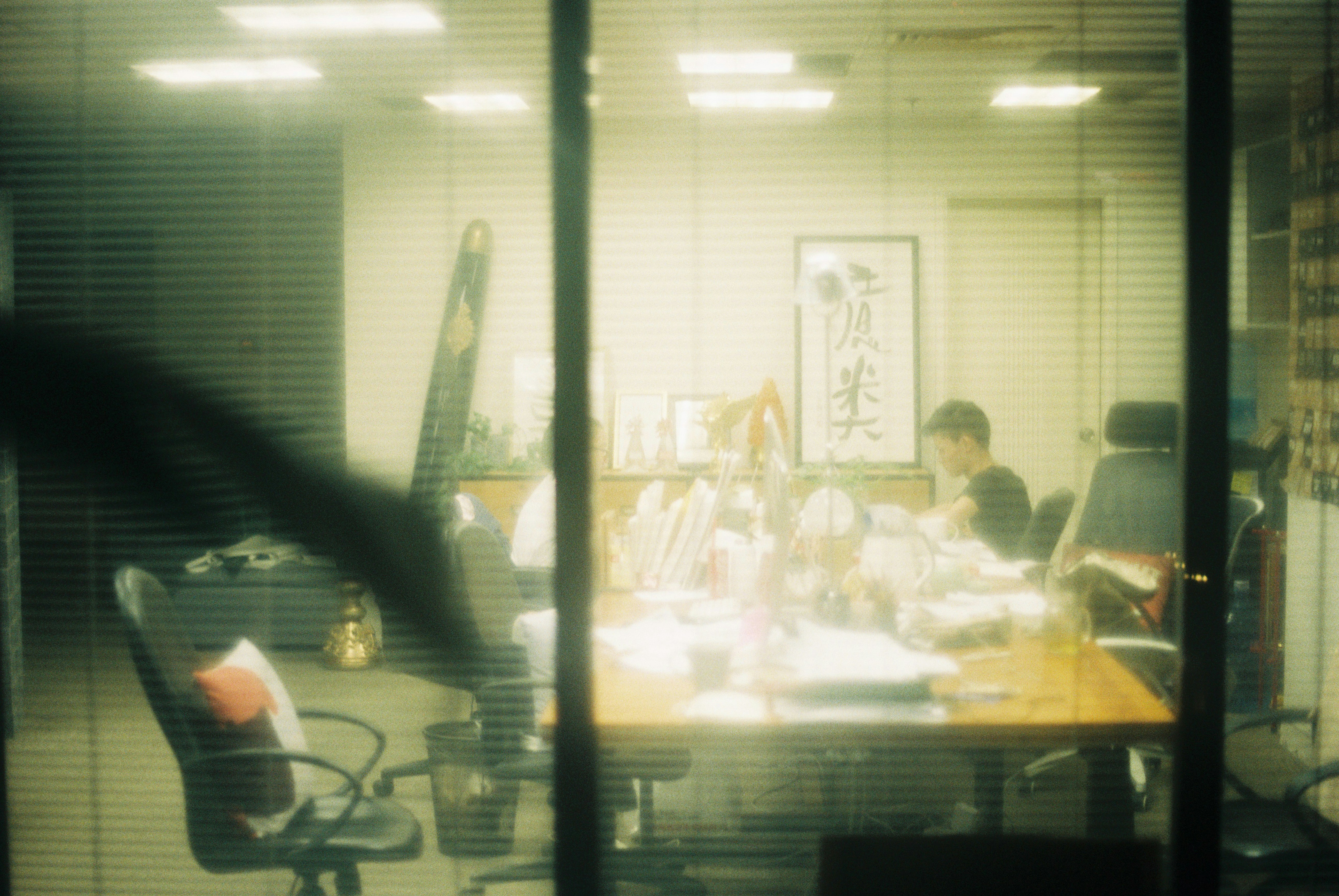 People gathered around a conference table in an office.