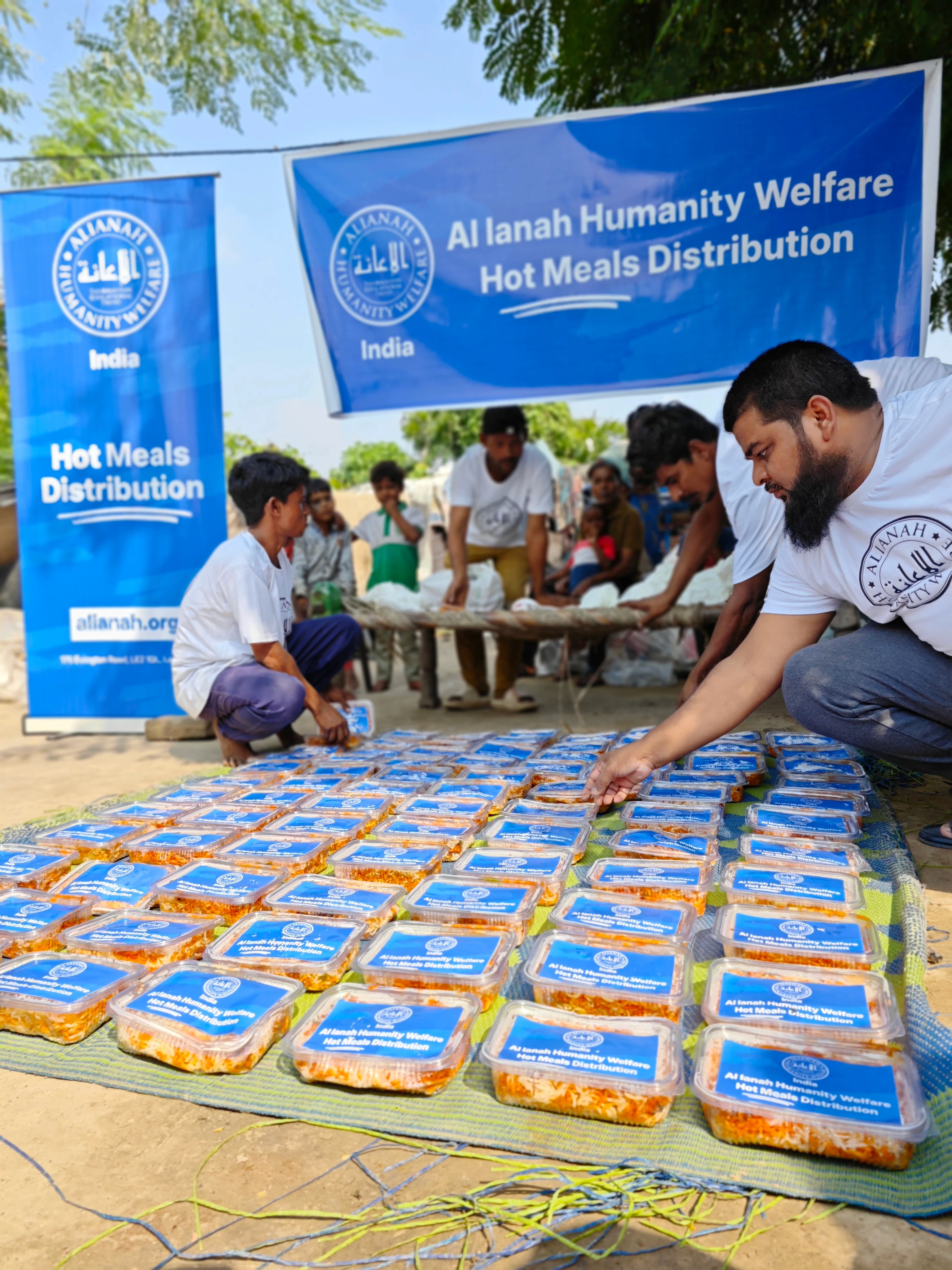 five children smiling while doing peace hand sign