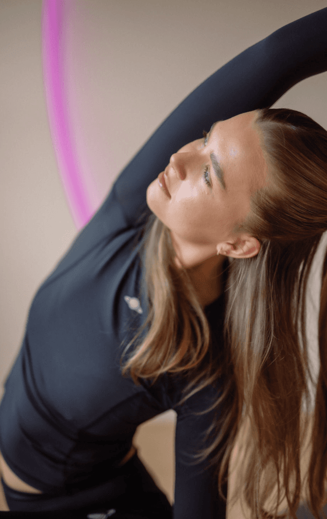 Black cosmetic product bottle against a dark background