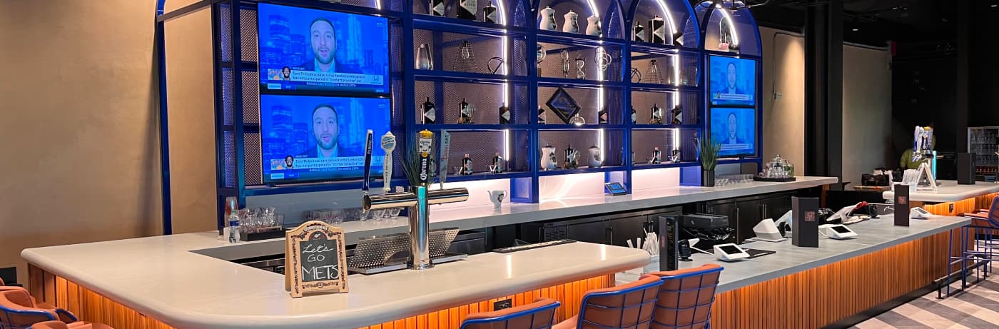 A bar with some tv screens