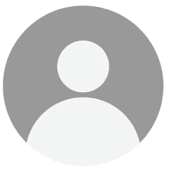 man in middle of wheat field