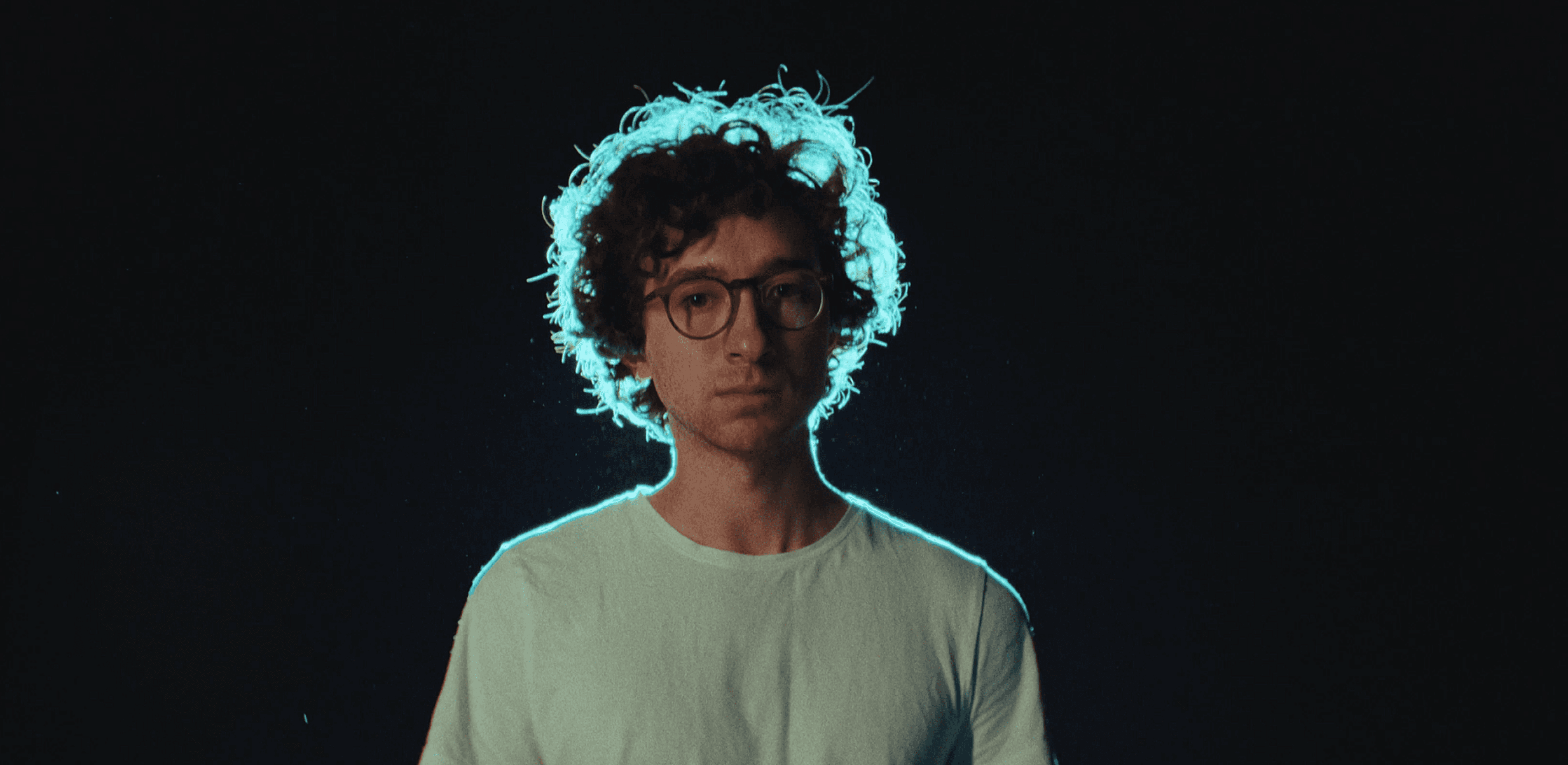 The image features an intricate network of white, web-like structures set against a deep blue background.