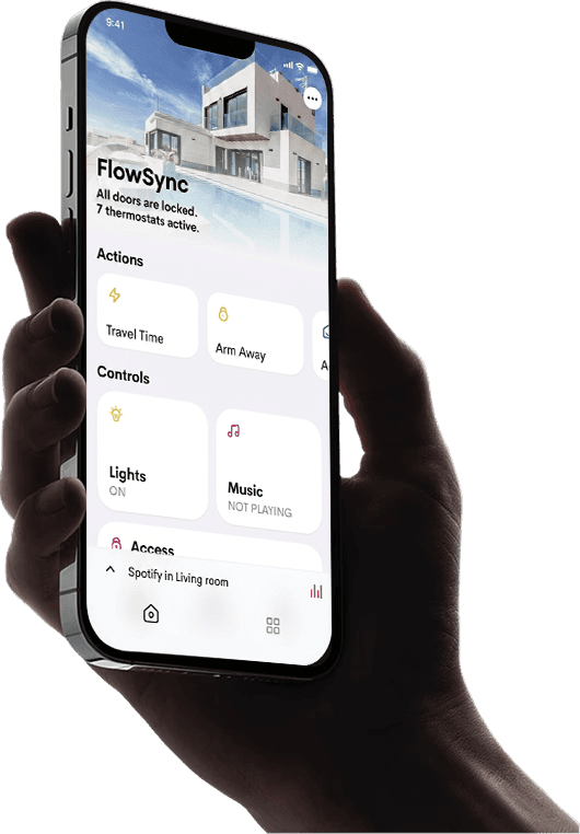 Hand holding a smartphone with a blank screen against a dark background.