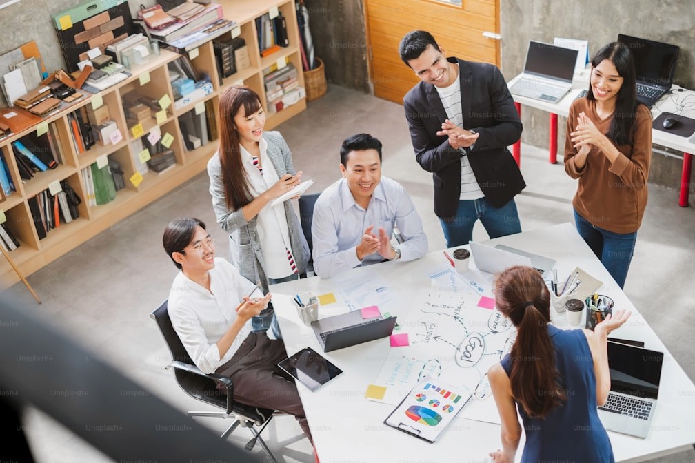 Group of people laughing and working inside an event