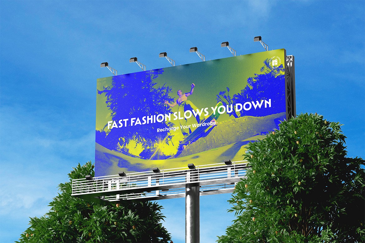A brightly colored billboard set against a clear blue sky features the message "Fast Fashion Slows You Down" with silhouettes of running athletes, surrounded by lush green foliage, promoting sustainable fashion choices.
