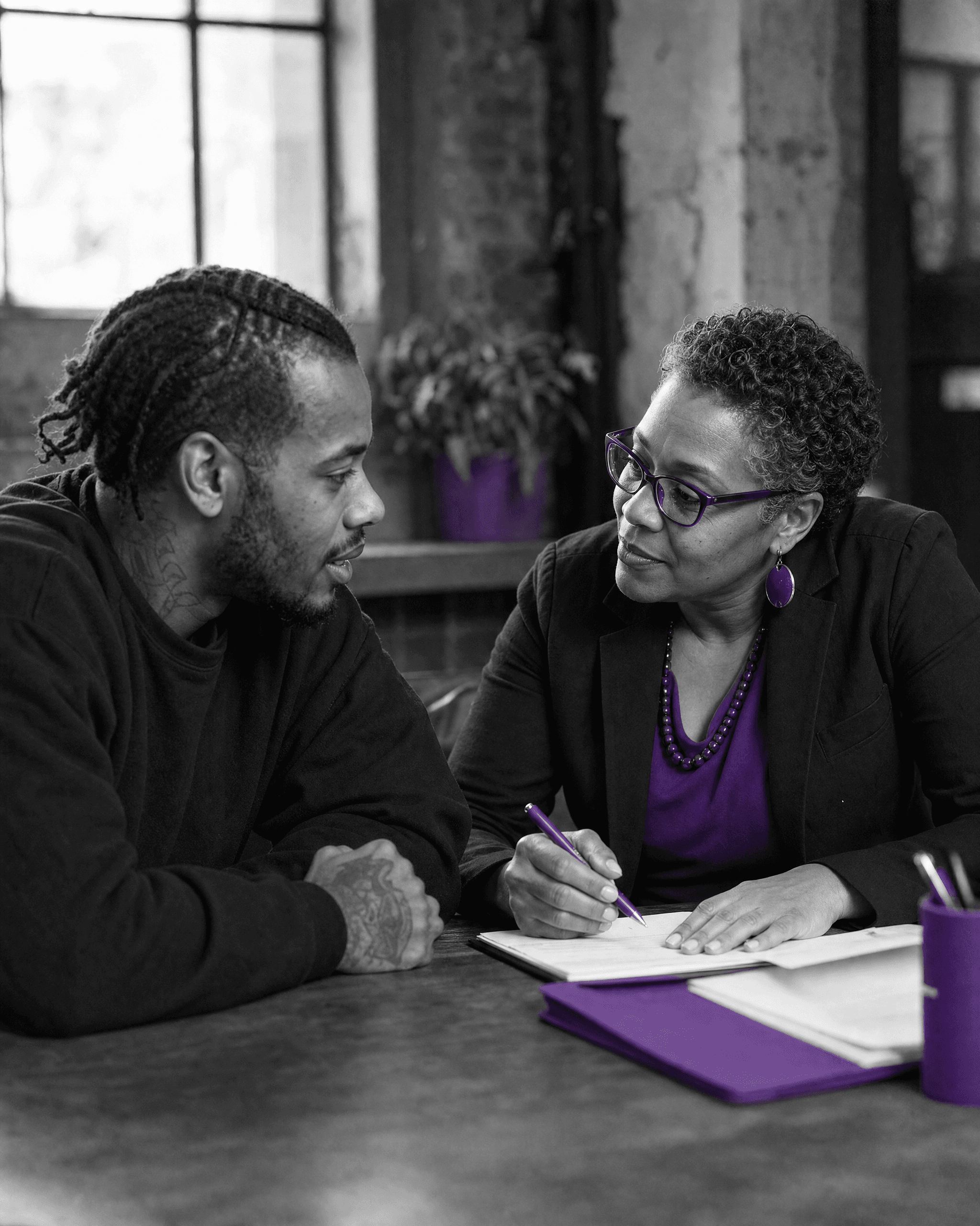 Trusted community connection helping someone access support.