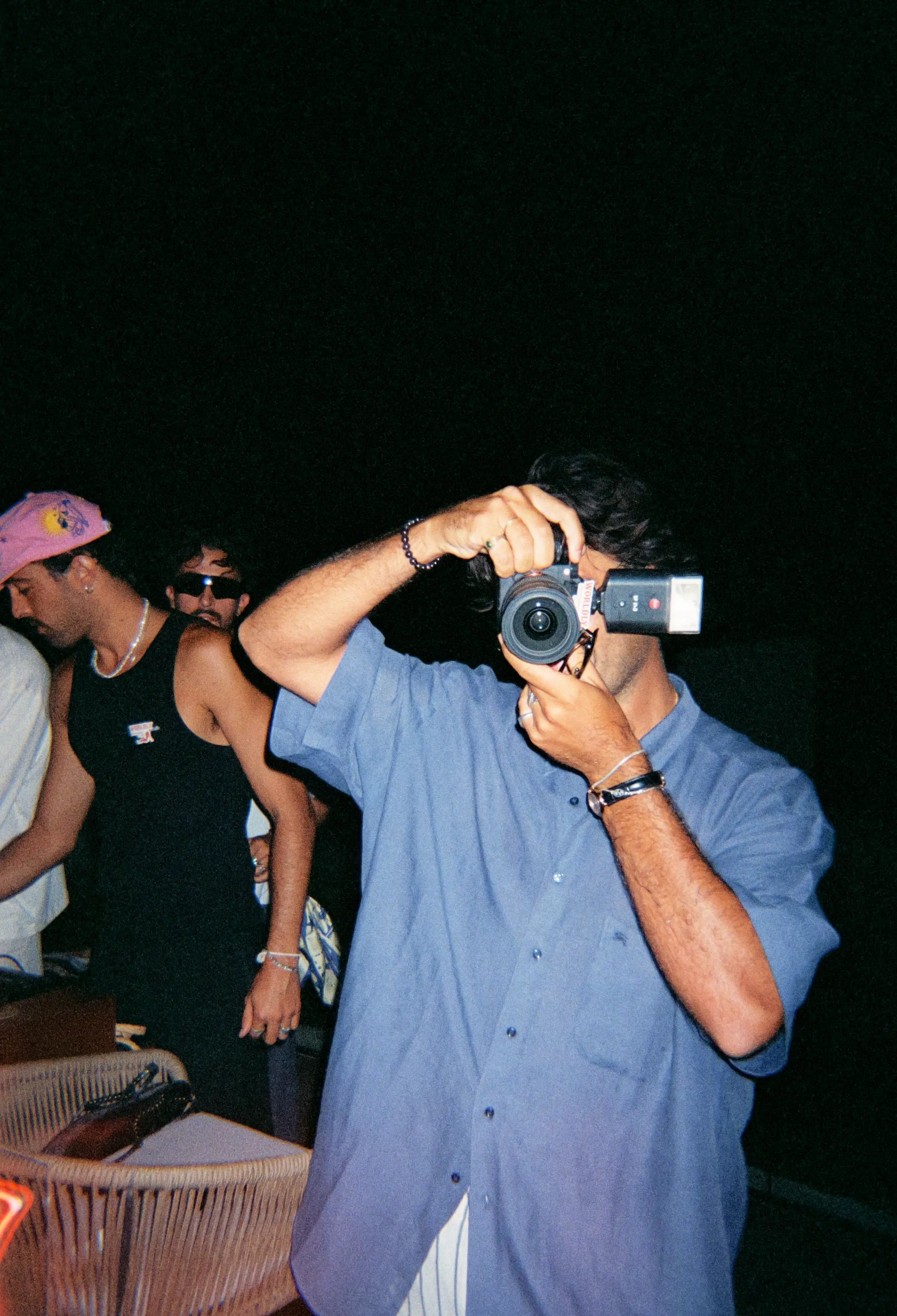 Antonio in a blue shirt taking a picture 