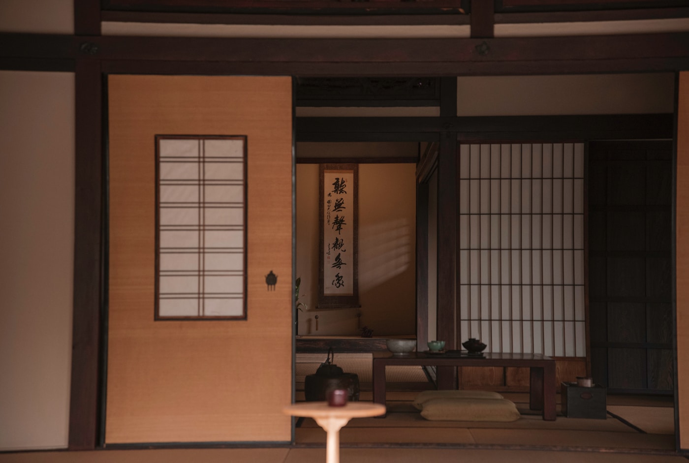 Serene traditional Japanese ryokan room with shoji screens and tatami floors