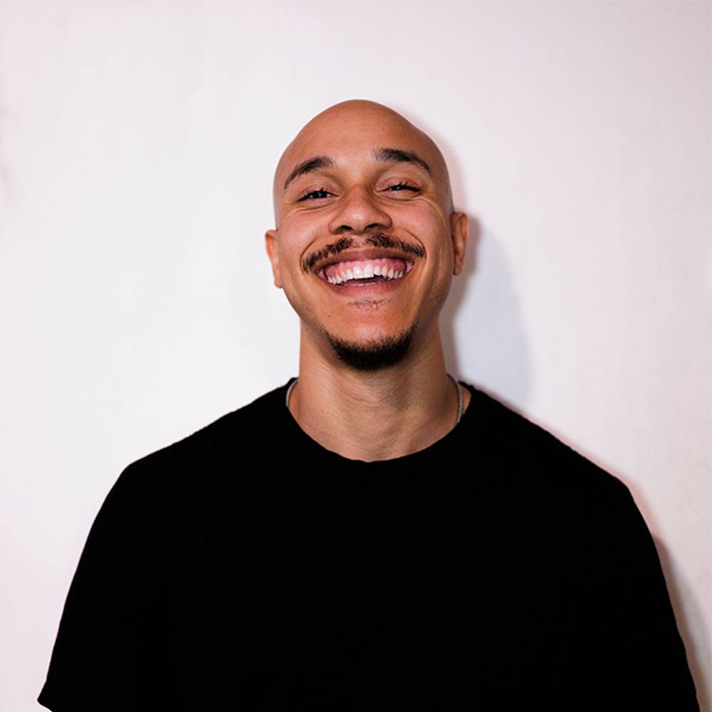 Midi Jones, music producer for Demi Lovato, Alessia Cara, and Ella Mai, smiling in a professional headshot.
