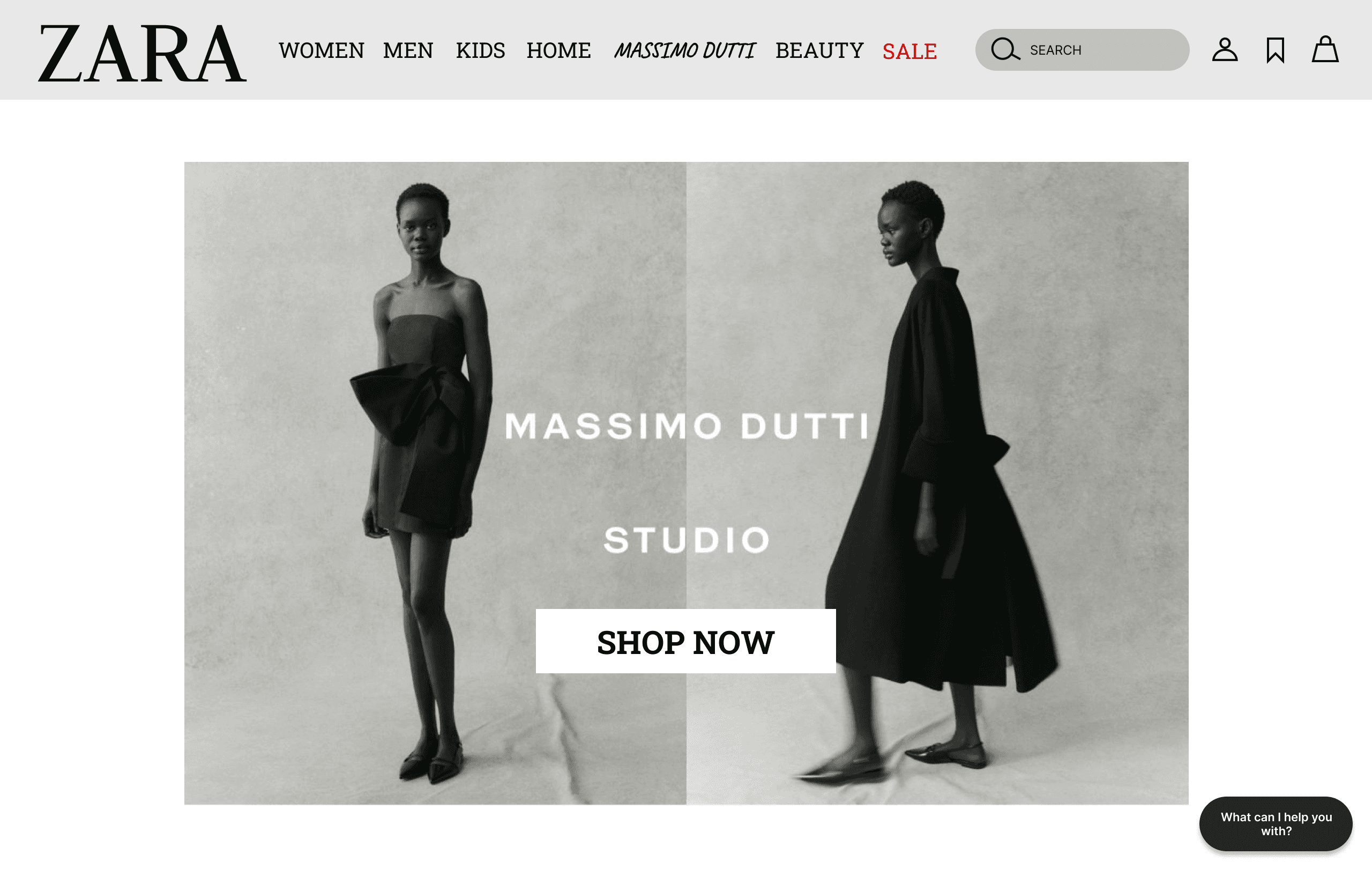 A fast black sports car races down the highway.