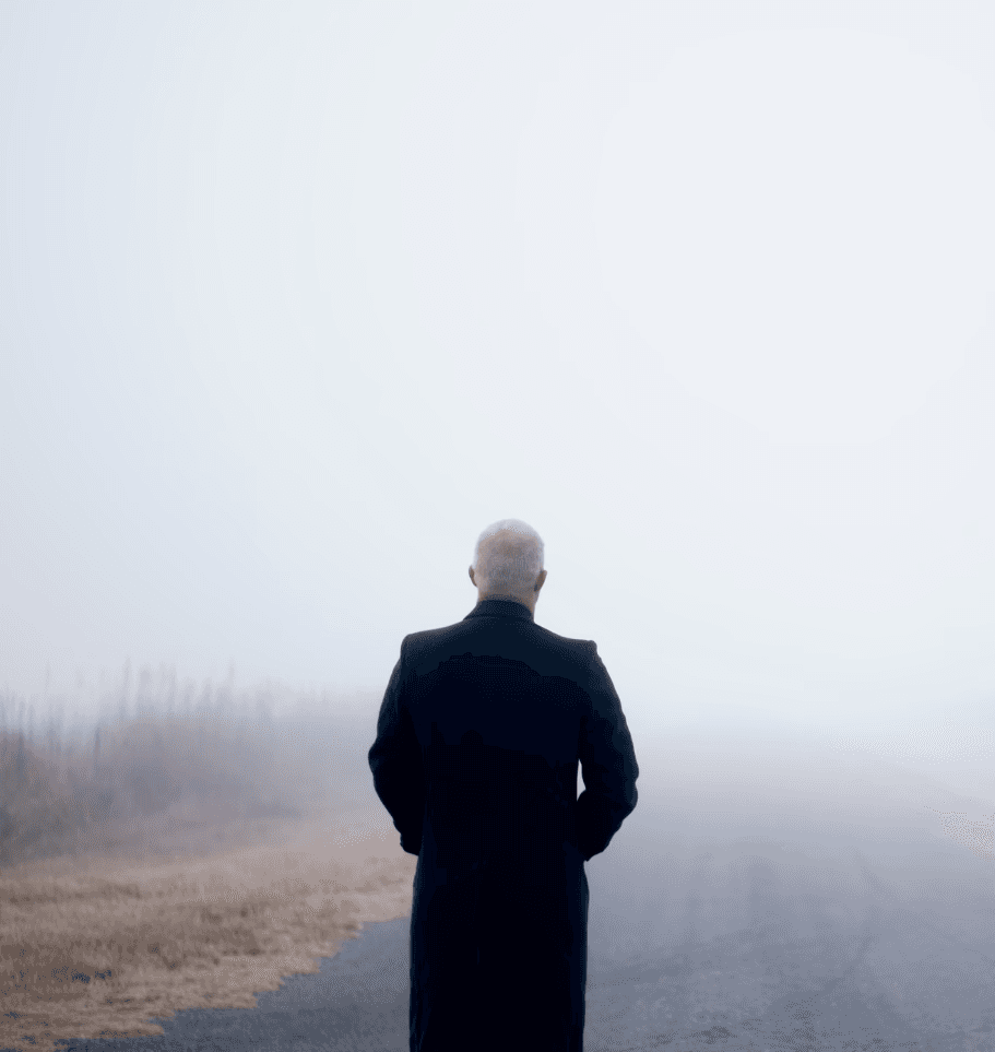 A woman receives a relaxing energy healing in a serene setting with soft lighting.